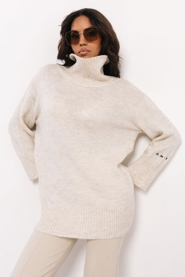 Kötött garbós tunika bézs